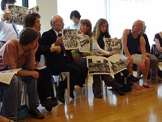 A hibakusha, a survivor of the atomic bombing of Nagasaki, tells young people about his experience and shows pictures. United Nations building in Vienna, duringt the NPT PrepCom 2007.