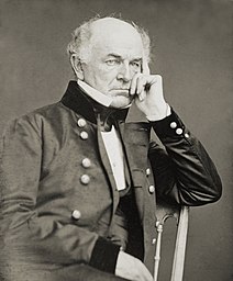 Gen. Ethan A. Hitchcock, three-quarter length portrait, seated in chair, facing right
