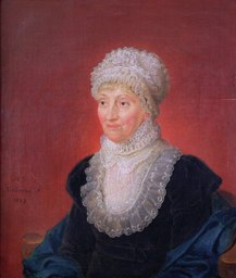 Brustbild als Ölgemälde der hannoverschen Wissenschaftlerin und Astronmin Caroline Herschel durch den um 1815 oder 1816 zum Königlich Hannoverschen Hofmaler erhobenen belgischen Kunstmaler Melchior Gommar Tieleman, links datiert 1829 und mit der Künstlersignatur

„M. S.
Tieleman, F.
1829“

...