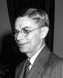 This is an image of Harvard University President James Byant Conant cropped from a larger image showing Conant receiving the Medal of Merit and Bronze Oak Leaf Cluster from President Harry S Truman.  Dr. Vannevar Bush also appears in the original photo.  According to the information from the Truman Library and President Museum accompanying the original image, the picture was taken by Abbie Rowe of the National Park Service, which places it in the public domain.  The Truman Library information acknowledges the usage status of the image as 