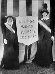 
Suffragists Mrs. Stanley McCormick (Katharine McCormick) and Mrs. Charles Parker, April 22, 1913, holding a banner between them reading 