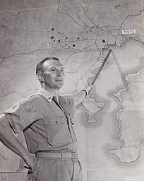 XXI Bomber Command commanding officer Brigadier General Haywood S. Hansell pointing to a map of Tokyo in November 1944