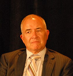 Photograph of Paul Volberding, AIDS researcher, Director of Research, Global Health Sciences, discussing 