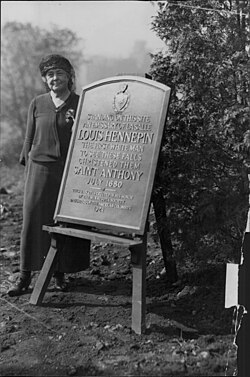 
Morris, state regent of the Daughters of the American Revolution, stands by a plaque commemorating Louis Hennepin at the Saint Anthony Falls.