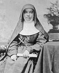 Mary MacKillop holding a copy of her Life Vows, 1869