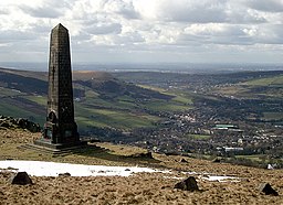 The Obelisk War Memorial on Alderman's Hill overlooking Greenfield, in Saddleworth, Greater Manchester, England.

Oldham is seen in the distance.