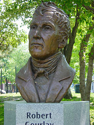 Bronze image of Robert Gourlay, Toronto, Canada. Image by User:Leonard G.
Plaque on base reads:


Robert Gourlay championed reform 
ahead of his time.
In Scotland-a vote for every man 
who could read and write 
In England-a living wage for workers 

In Canada-fair land distribution