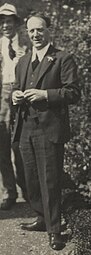 Cropped and background blurred from Elfrida de la Mare (née Ingpen); Gilbert Spencer; Walter de la Mare, by Lady Ottoline Morrell (died 1938). See source website for additional information.